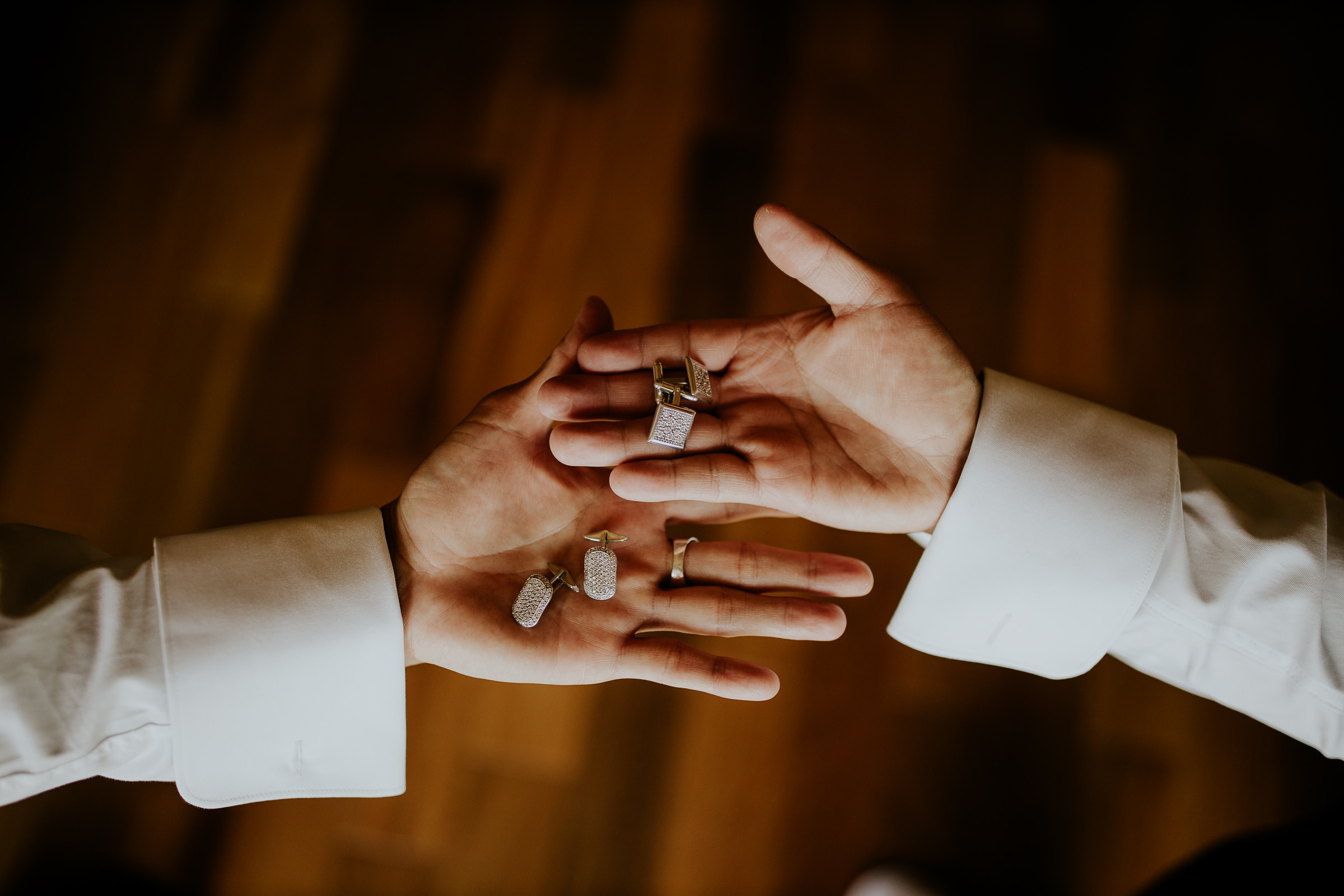 hands with wedding accessories