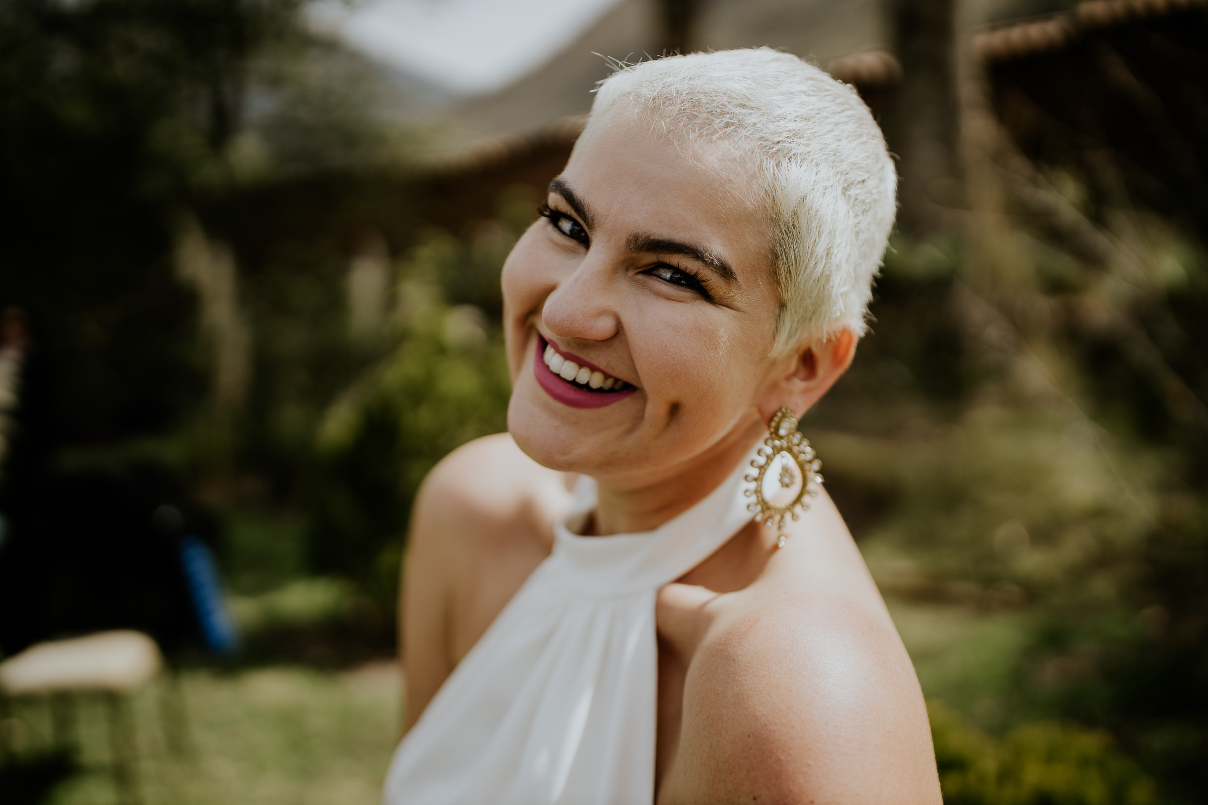 white short hair woman smiling to the camera